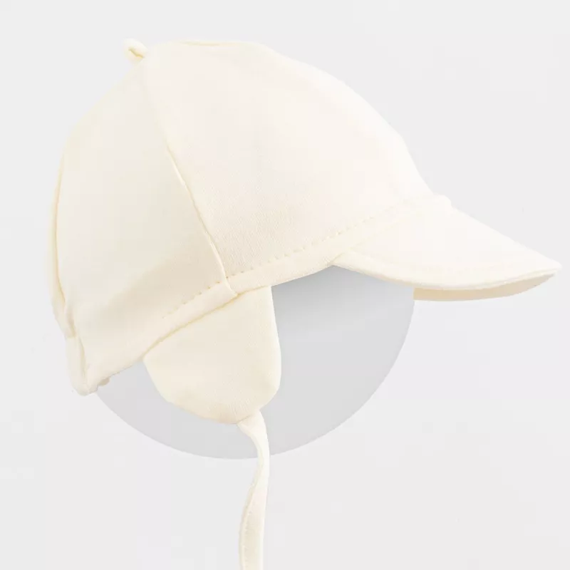 Dětská bavlněná čepička s kšiltem New Baby Casually dressed cream Smetanová